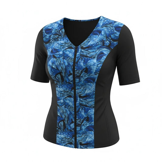 Covertogs Swimwear slimline tankini top with elbow sleeves, front zip, and blue surreal nature print on black panels.